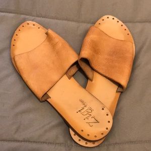 Brown leather slides